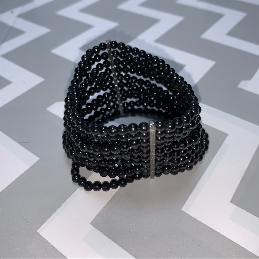 Small bead wide multi strand bracelet